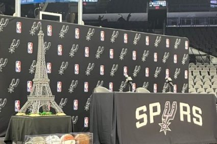 Full face! Spurs rookie conference site layout Eiffel Tower + French flag