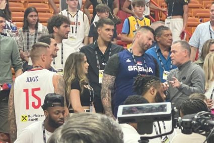 Malone shook hands with brother jokiki and chatted after the game. Bogdan was also at the scene.